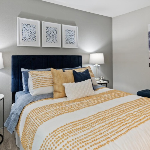 Generous bedroom offerings to fit every family a bedroom with a bed and lamps