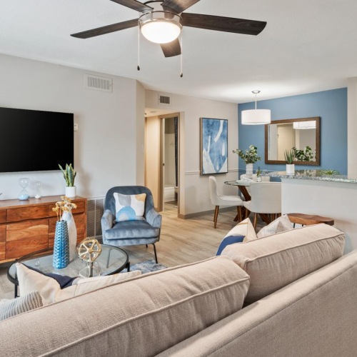 Find your perfect fit at Magnolia Falls a living room with a tv and a couch