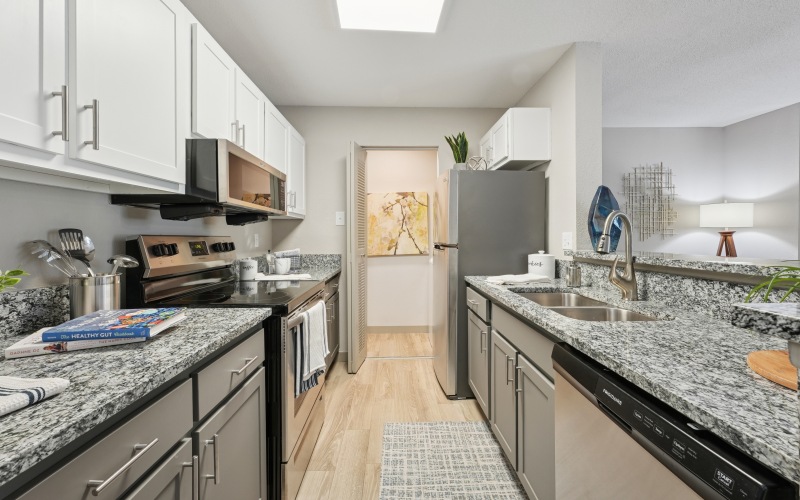 a kitchen with white cabinets